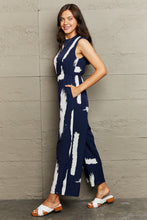 Load image into Gallery viewer, Perfee Printed Round Neck Cutout Jumpsuit with Pockets
