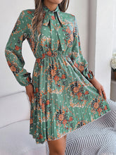 Load image into Gallery viewer, Pleated Printed Tie Neck Long Sleeve Dress