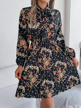Load image into Gallery viewer, Pleated Printed Tie Neck Long Sleeve Dress