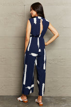 Load image into Gallery viewer, Perfee Printed Round Neck Cutout Jumpsuit with Pockets