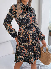 Load image into Gallery viewer, Pleated Printed Tie Neck Long Sleeve Dress