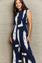 Load image into Gallery viewer, Perfee Printed Round Neck Cutout Jumpsuit with Pockets