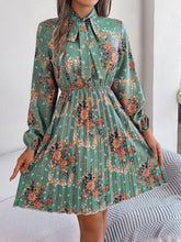 Load image into Gallery viewer, Pleated Printed Tie Neck Long Sleeve Dress
